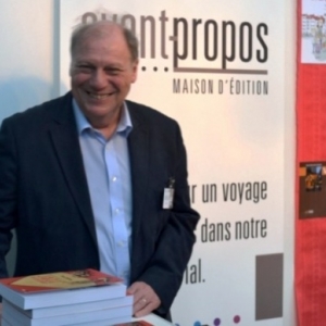 Tout souriant, Herve Gerard, President de la "Foire du Livre" et Directeur general des "Editions Racine"